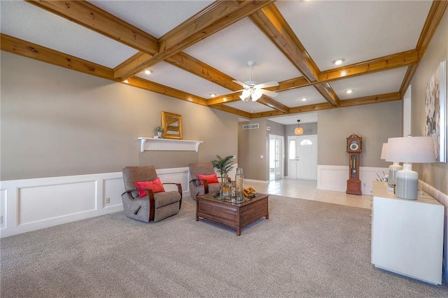 living room featuring a wainscoted wall, coffered ceiling, beam ceiling, recessed lighting, and carpet flooring