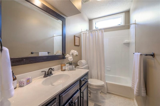 full bath featuring tile patterned flooring, toilet, shower / tub combo with curtain, a textured ceiling, and vanity