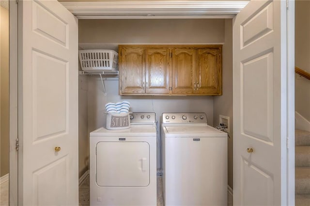 laundry area featuring cabinet space and washing machine and dryer