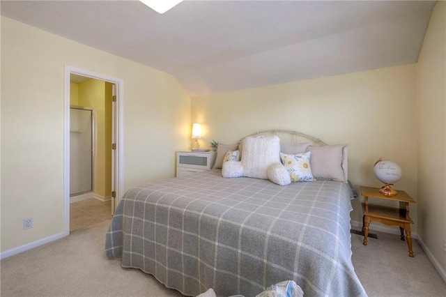 bedroom with baseboards, lofted ceiling, and carpet floors