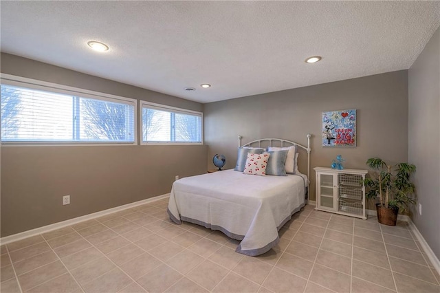 bedroom featuring light tile patterned flooring, recessed lighting, a textured ceiling, and baseboards