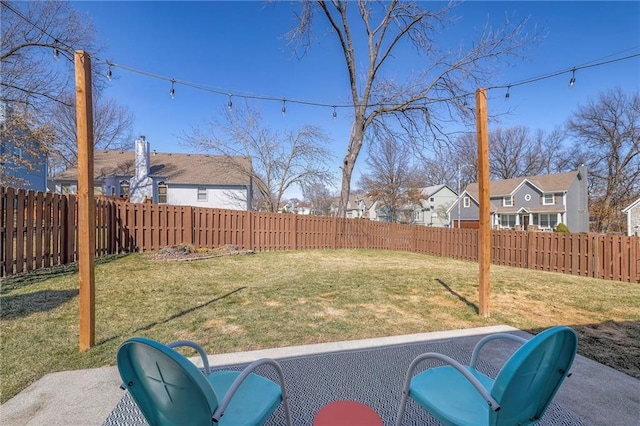 view of yard with a residential view and a fenced backyard