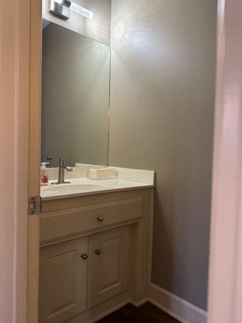 bathroom with vanity and baseboards