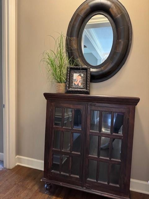 room details with baseboards and wood finished floors