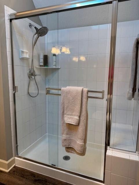 full bathroom with a shower stall