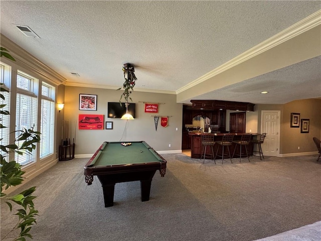 rec room with visible vents, baseboards, light colored carpet, ornamental molding, and a bar