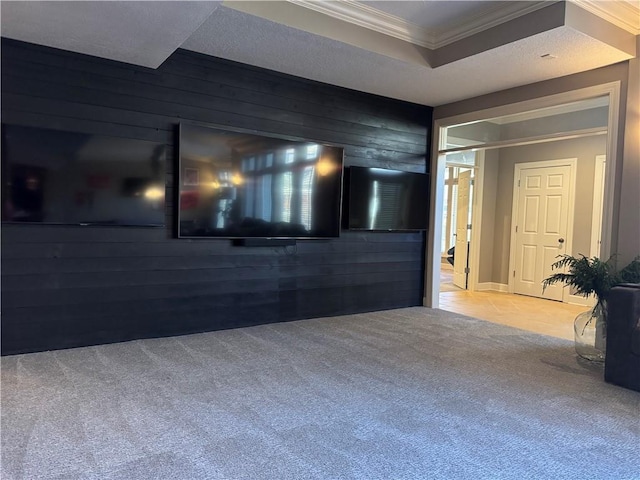 carpeted empty room featuring wooden walls and ornamental molding