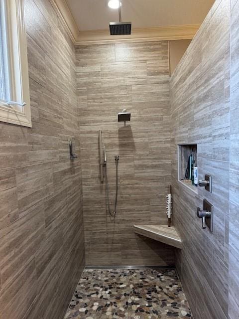 full bath featuring tiled shower and crown molding