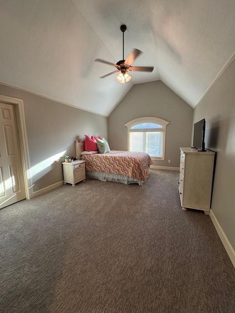 carpeted bedroom with lofted ceiling, baseboards, and ceiling fan