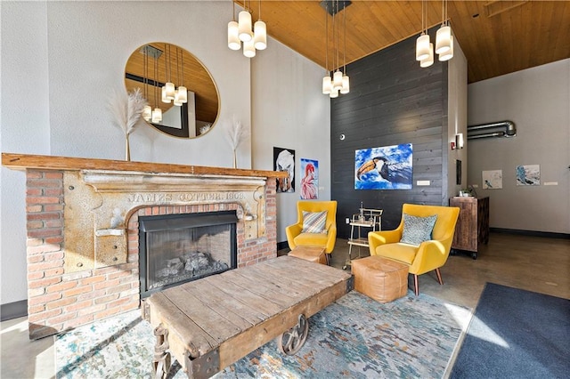 living room with wooden walls, baseboards, high vaulted ceiling, a fireplace, and wooden ceiling