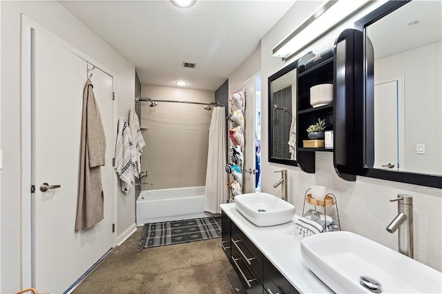 full bathroom featuring double vanity, shower / bathtub combination with curtain, visible vents, and a sink