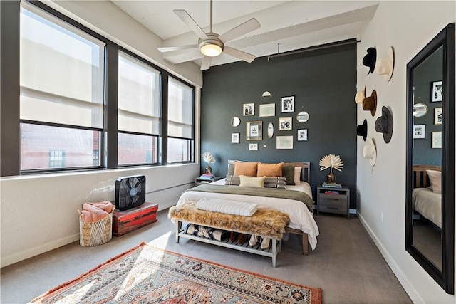 carpeted bedroom featuring a ceiling fan and baseboards