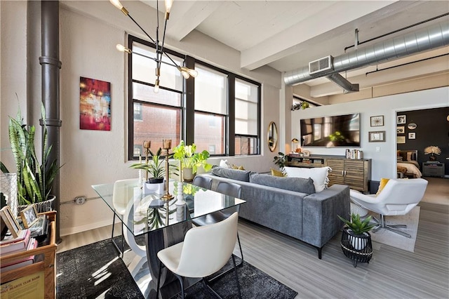 dining space with beam ceiling, visible vents, and baseboards