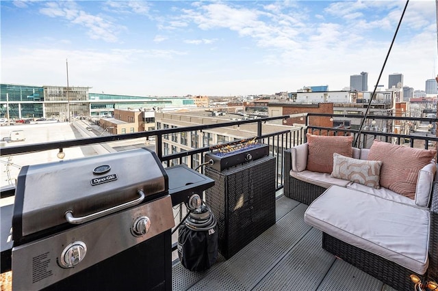 balcony with a city view, an outdoor living space, and grilling area