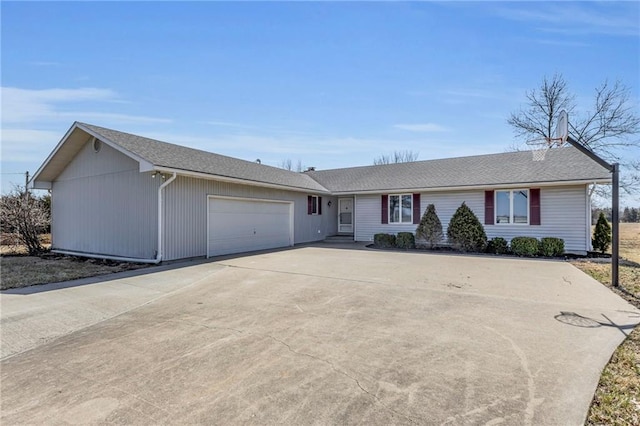 single story home featuring driveway, a shingled roof, and a garage