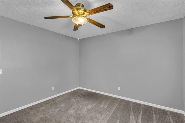 spare room featuring ceiling fan, carpet flooring, baseboards, and a textured ceiling