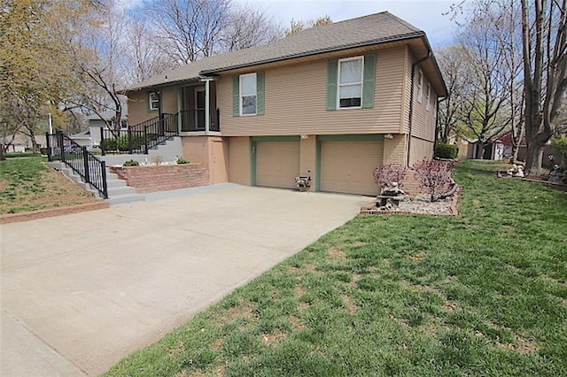225 N Woodson Dr, Raymore, MO 64083 - view of front facade featuring a garage, a front yard, and concrete driveway