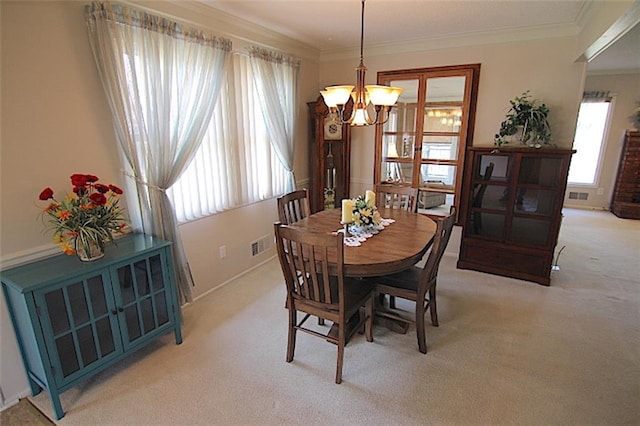 225 N Woodson Dr, Raymore, MO 64083 - dining space with light carpet, plenty of natural light, a notable chandelier, and visible vents