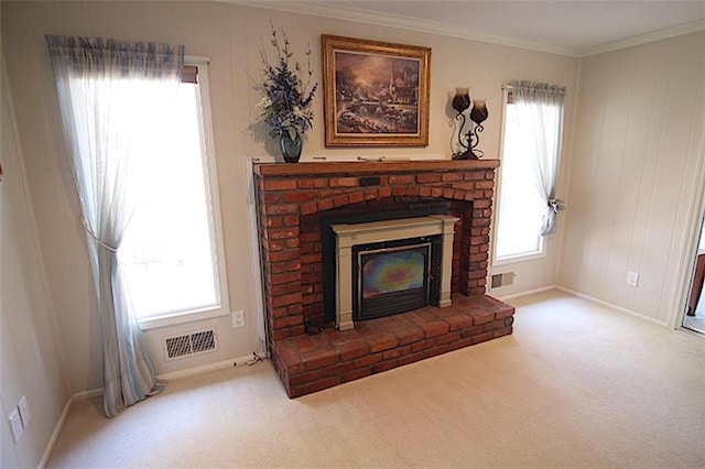 225 N Woodson Dr, Raymore, MO 64083 - interior details with carpet, visible vents, ornamental molding, and a brick fireplace