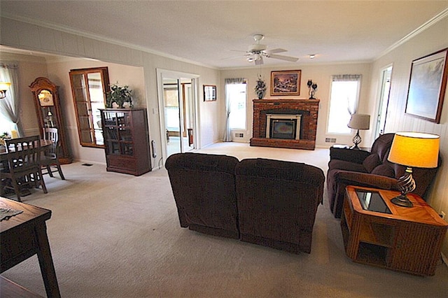 225 N Woodson Dr, Raymore, MO 64083 - living area featuring light carpet, ceiling fan, and crown molding
