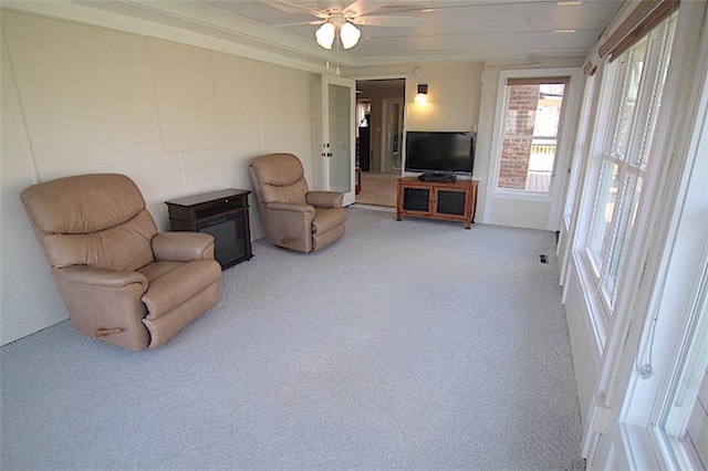 225 N Woodson Dr, Raymore, MO 64083 - sitting room featuring ceiling fan and carpet