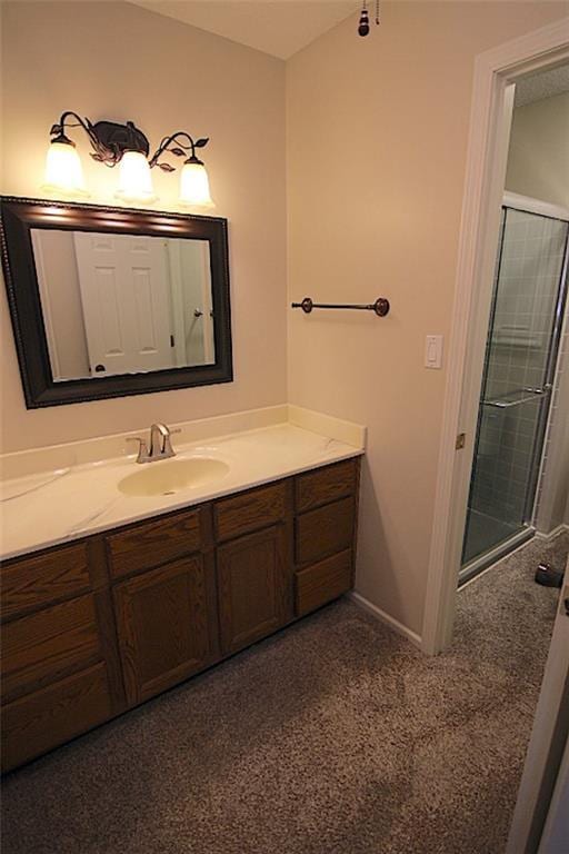 225 N Woodson Dr, Raymore, MO 64083 - bathroom featuring a tile shower, vanity, and baseboards