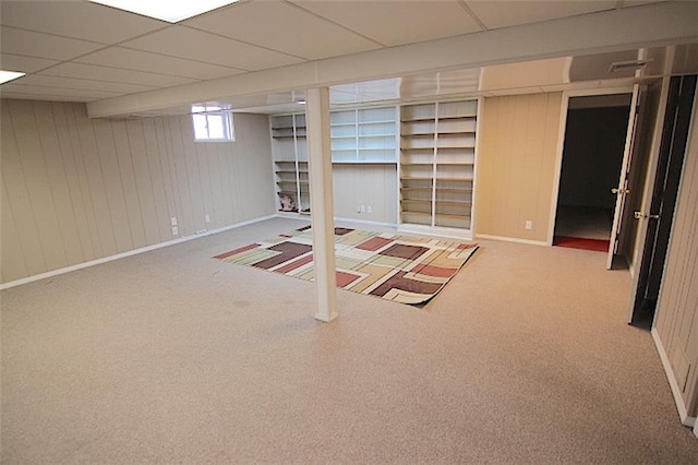 225 N Woodson Dr, Raymore, MO 64083 - basement with carpet floors, baseboards, and a drop ceiling