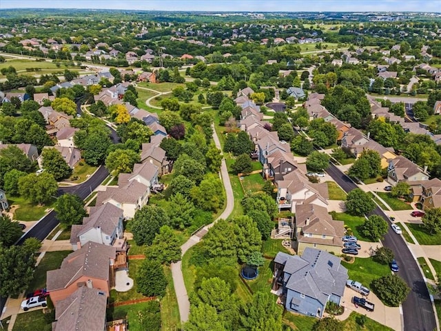 birds eye view of property with a residential view