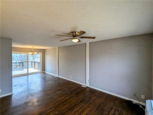 empty room featuring wood finished floors, baseboards, a textured wall, a textured ceiling, and ceiling fan with notable chandelier