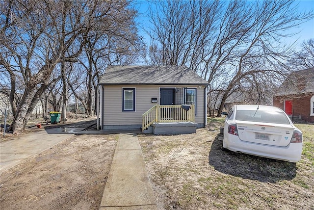 view of front of home with a shingled roof