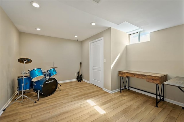 game room featuring recessed lighting, baseboards, and wood finished floors