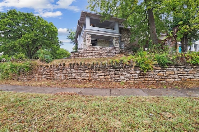 exterior space featuring stone siding