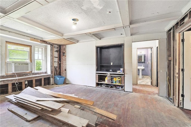 misc room featuring beam ceiling and coffered ceiling