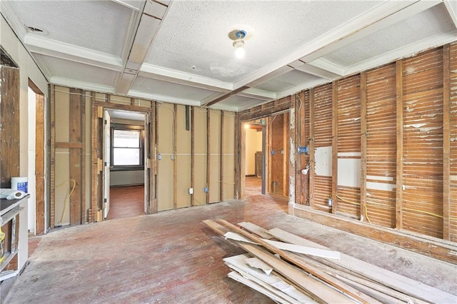 misc room featuring coffered ceiling, a textured ceiling, and ornamental molding