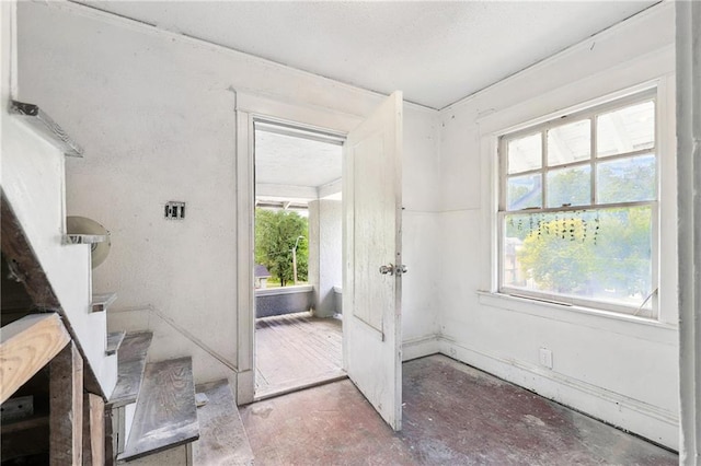 entryway with stairs and a healthy amount of sunlight