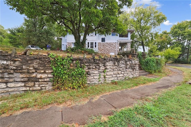 exterior space with stone siding