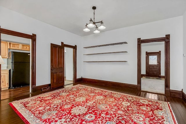 entryway featuring visible vents, baseboards, and dark wood-style flooring