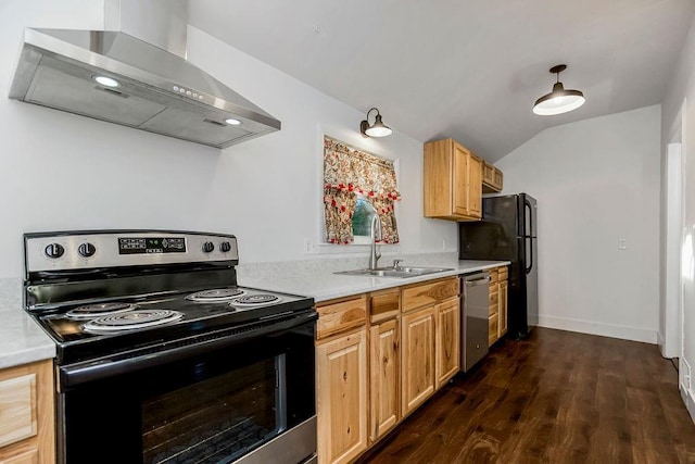 kitchen featuring light countertops, lofted ceiling, black appliances, wall chimney exhaust hood, and a sink