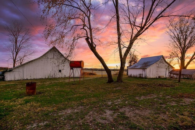 view of yard featuring an outbuilding and a barn