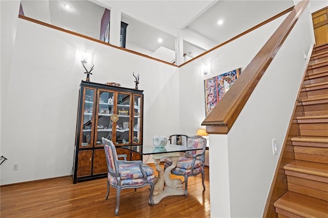 dining area featuring stairs, recessed lighting, and wood finished floors