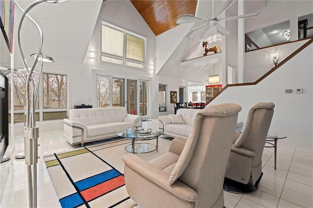 living room featuring ceiling fan, high vaulted ceiling, wooden ceiling, and light tile patterned flooring