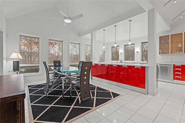 dining area with high vaulted ceiling, light tile patterned flooring, and a ceiling fan