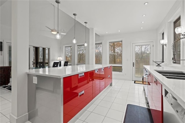 kitchen featuring pendant lighting, a sink, recessed lighting, light tile patterned floors, and dishwashing machine