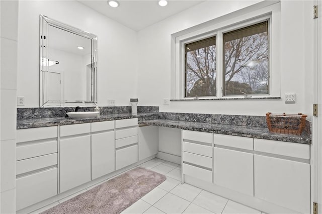 bathroom with tile patterned flooring, recessed lighting, and vanity