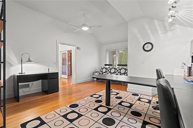 office area featuring visible vents, baseboards, ceiling fan, vaulted ceiling, and light wood-type flooring