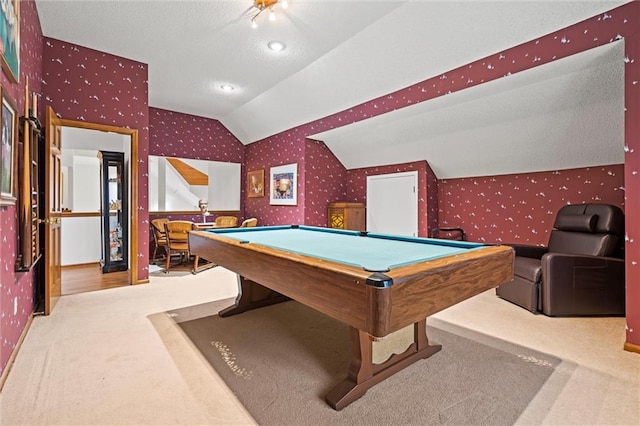 rec room featuring wallpapered walls, vaulted ceiling, and carpet