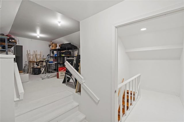 stairs with lofted ceiling