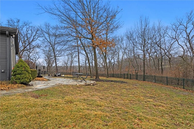 view of yard featuring a patio and fence