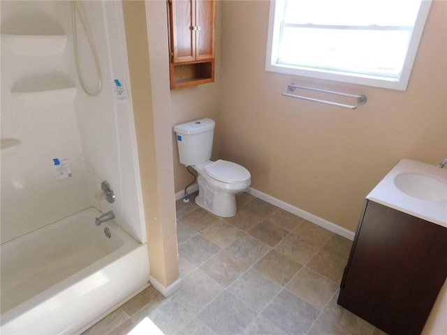 full bathroom with shower / washtub combination, toilet, vanity, and baseboards