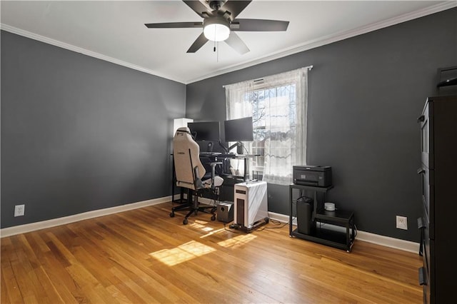 office area with ceiling fan, baseboards, light wood-style floors, and ornamental molding